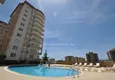 Купить Квартира с двумя спальнями в закрытом комплексе недалеко от моря в Тосмуре, Алания 2