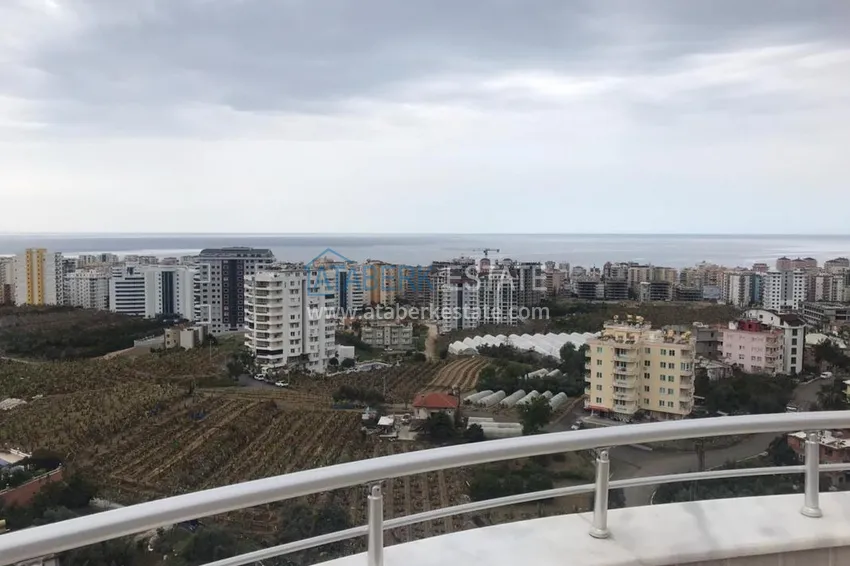 Приобрести Меблированный двухуровневый пентхаус с видом на море в районе Махмутлар 1