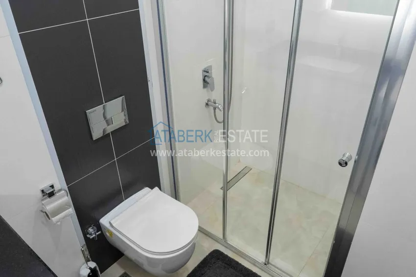 Приобрести Квартира в Махмутларе меблированная с видом на море и горы в комплексе класса люкс 14 