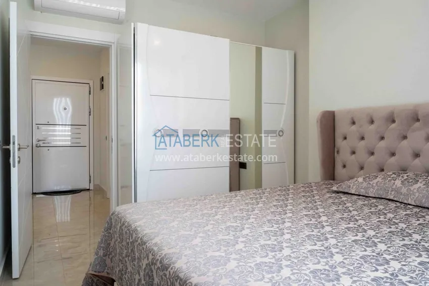 Приобрести Квартира в Махмутларе меблированная с видом на море и горы в комплексе класса люкс 10 