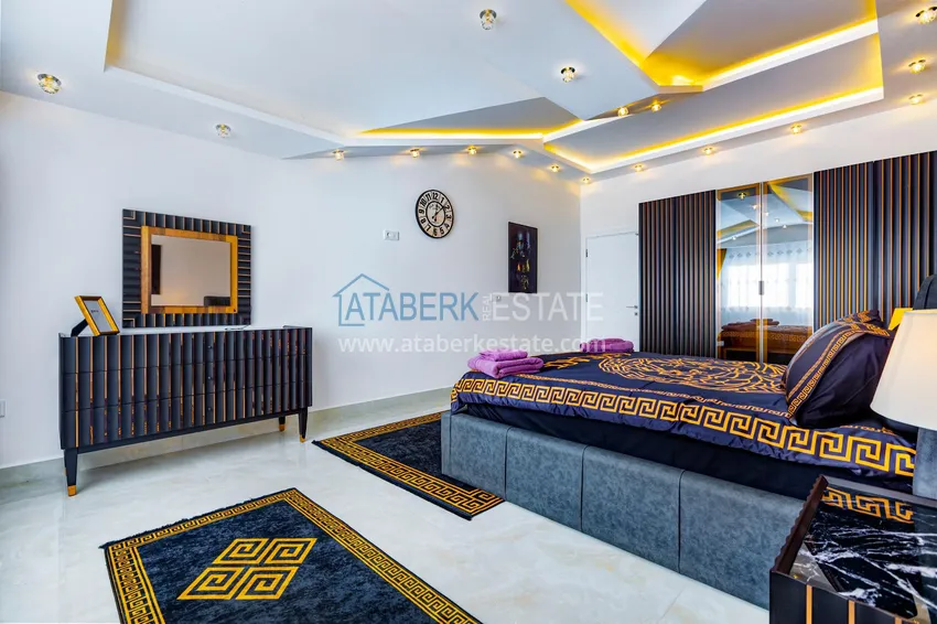 Приобрести Пентхаус в Махмутларе – изысканный интерьер, отдельная кухня, боковой вид на море  10 