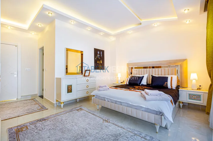 Приобрести Пентхаус в Махмутларе – изысканный интерьер, отдельная кухня, боковой вид на море  12 