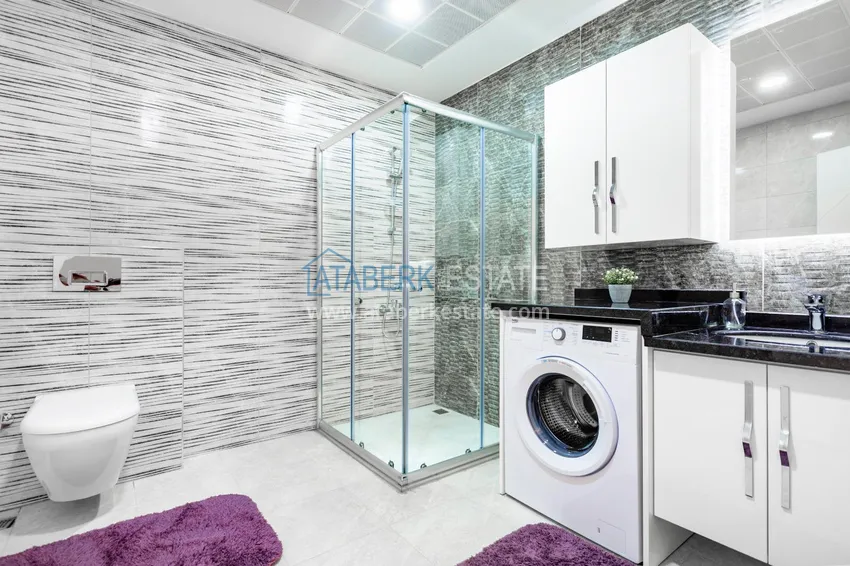 Приобрести Пентхаус в Махмутларе – изысканный интерьер, отдельная кухня, боковой вид на море  16 