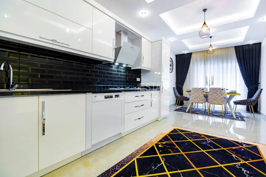 Приобрести Пентхаус в Махмутларе – изысканный интерьер, отдельная кухня, боковой вид на море  5 