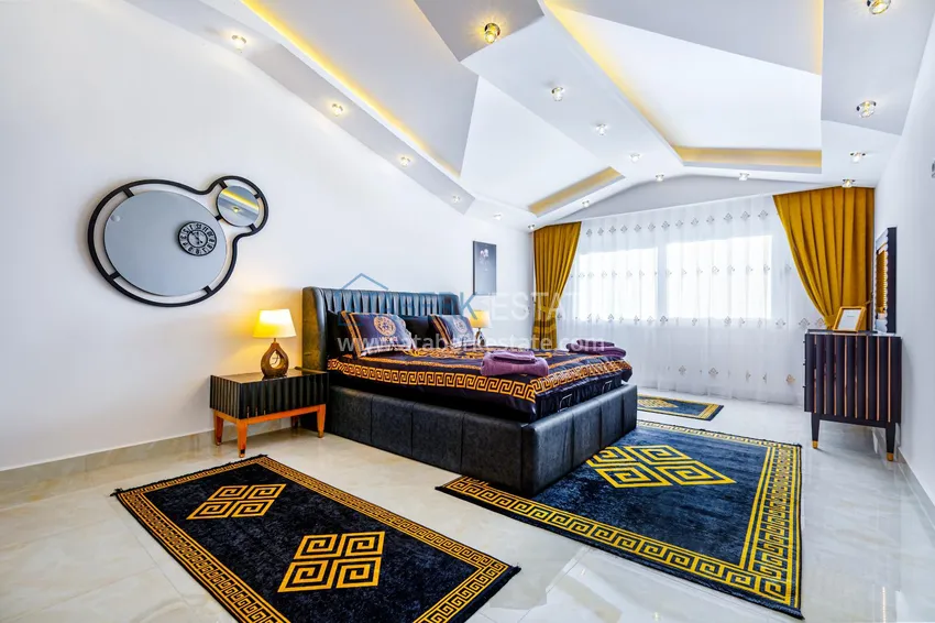 Приобрести Пентхаус в Махмутларе – изысканный интерьер, отдельная кухня, боковой вид на море  9 