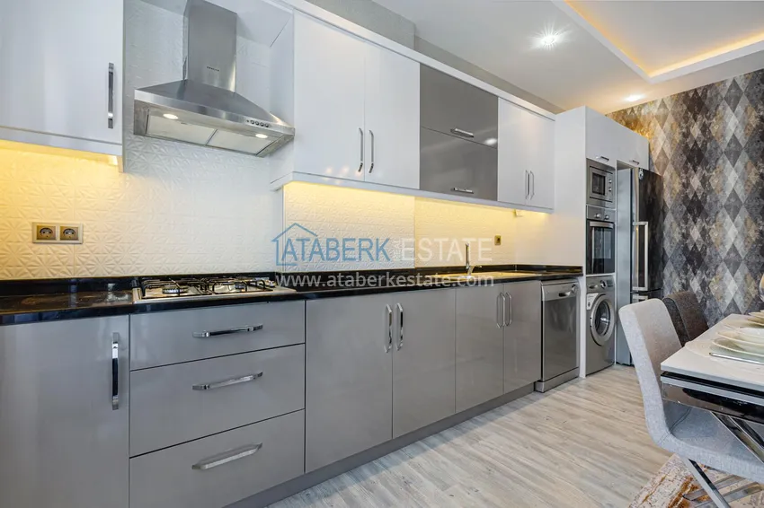 Приобрести Квартира в Махмутларе - современный интерьер частичный вид на море 10 