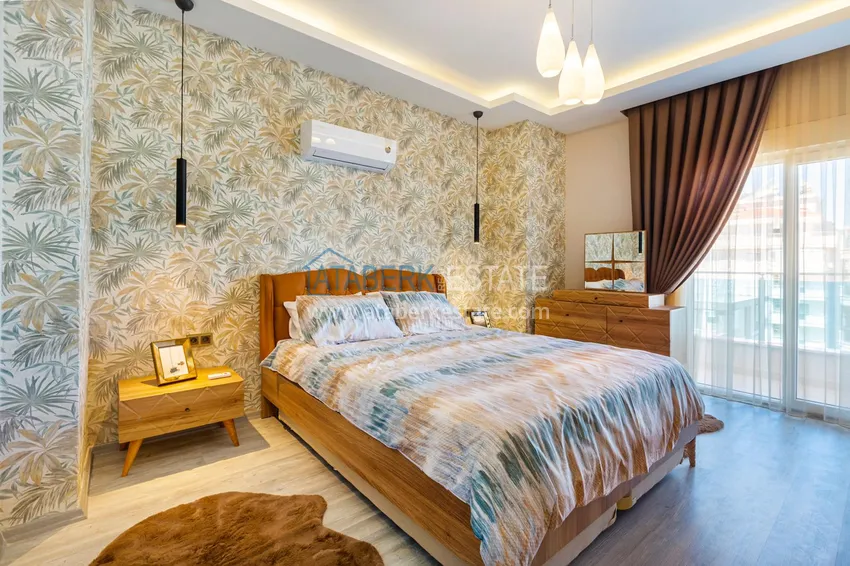 Приобрести Квартира в Махмутларе - современный интерьер частичный вид на море 14 