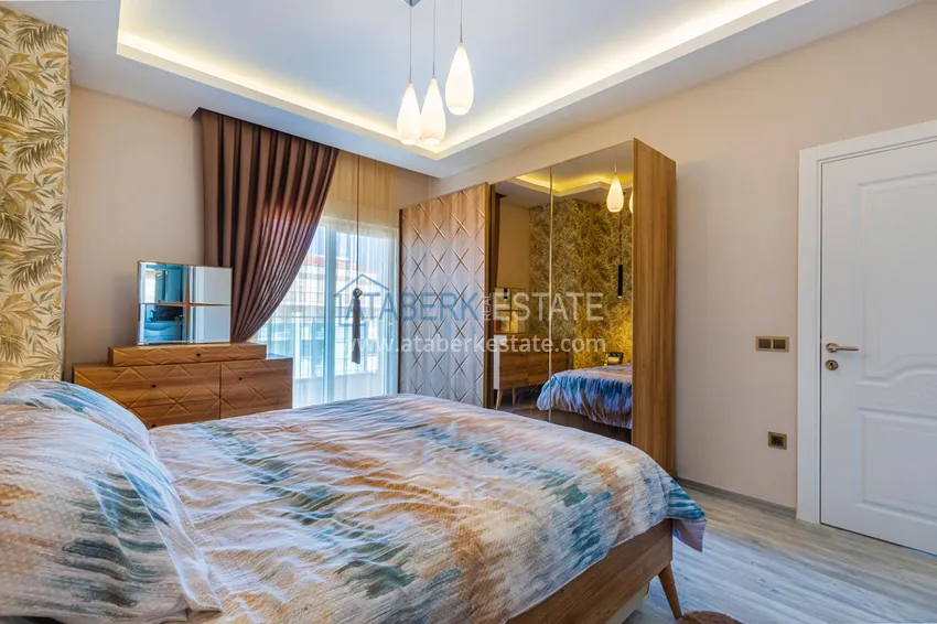 Приобрести Квартира в Махмутларе - современный интерьер частичный вид на море 15 