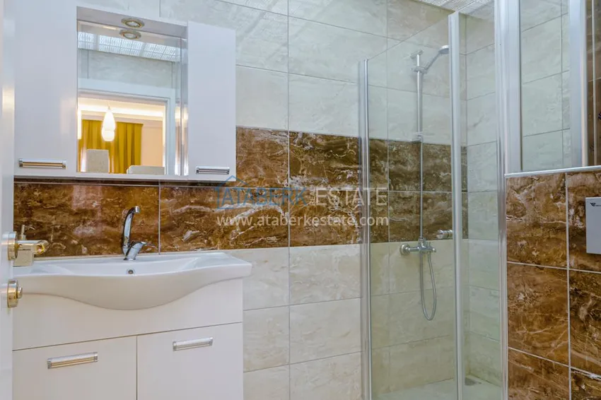 Приобрести Квартира в Махмутларе - современный интерьер частичный вид на море 17 