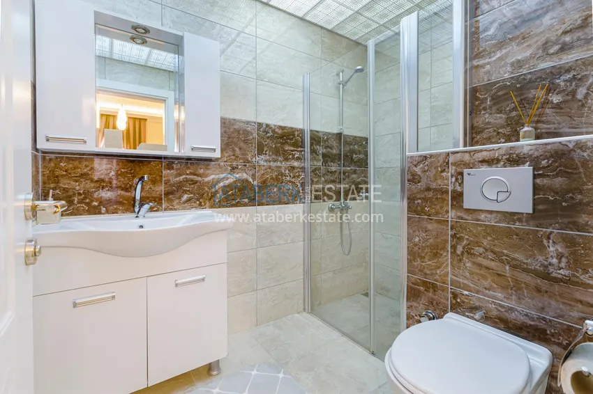 Приобрести Квартира в Махмутларе - современный интерьер частичный вид на море 18 