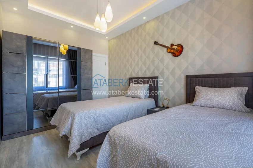 Приобрести Квартира в Махмутларе - современный интерьер частичный вид на море 21 