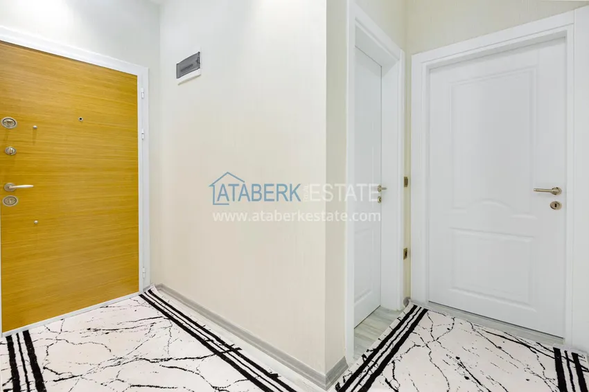 Приобрести Квартира в Махмутларе - современный интерьер частичный вид на море 1 