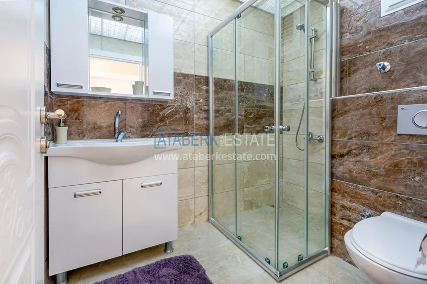 Приобрести Квартира в Махмутларе - современный интерьер частичный вид на море 23 