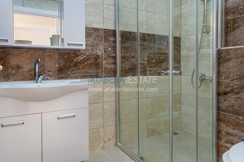 Приобрести Квартира в Махмутларе - современный интерьер частичный вид на море 24 