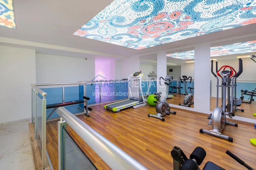 Квартира в Махмутларе - современный интерьер частичный вид на море 5 