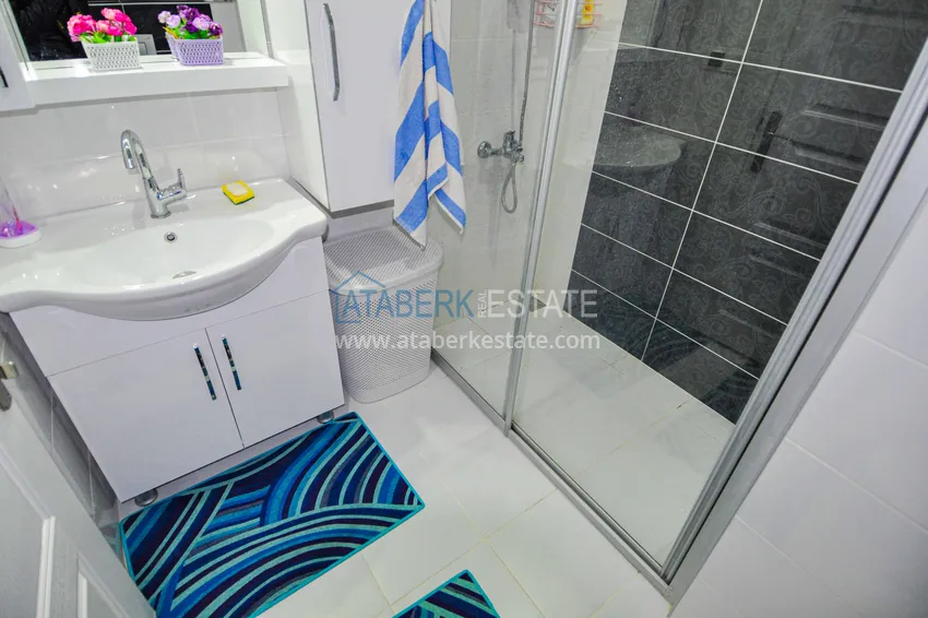 Приобрести Квартира в Махмутларе с отдельной кухней и видом на море  11 