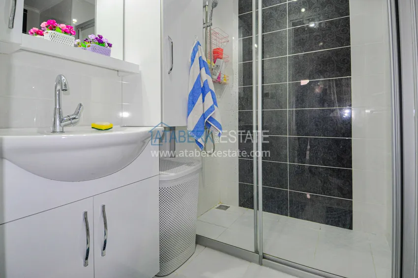 Приобрести Квартира в Махмутларе с отдельной кухней и видом на море  12 