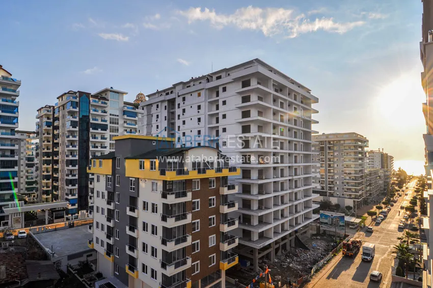 Приобрести Квартира в Махмутларе с отдельной кухней и видом на море  21 