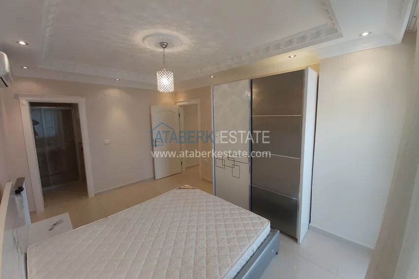 Приобрести Квартира в Махмутларе с мебелью, видом на море и горы, на центральной улице 15 