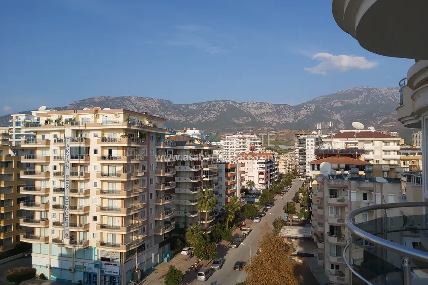 Приобрести Квартира в Махмутларе с мебелью, видом на море и горы, на центральной улице 19 