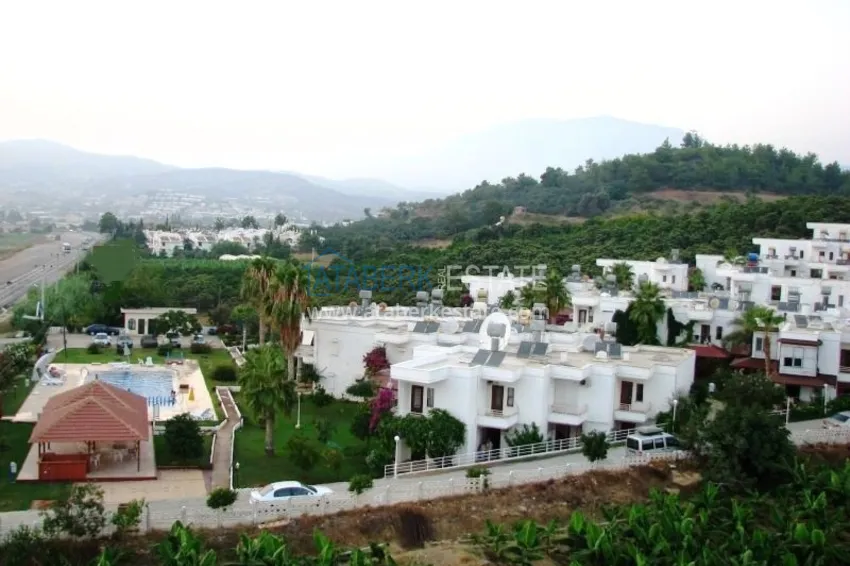 Таунхаус в районе Демирташ с мебелью, садом и видом на море  1 