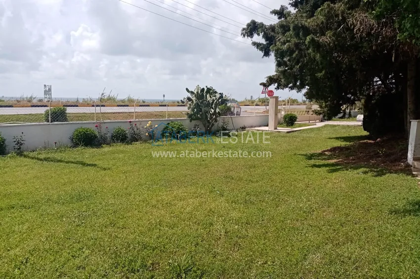 Таунхаус в районе Демирташ с мебелью, садом и видом на море  10 