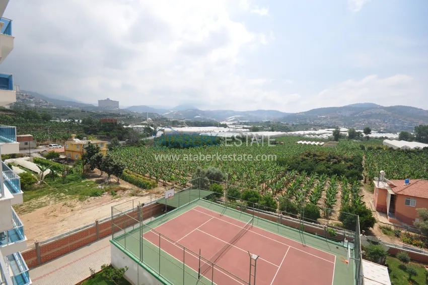 Приобрести Квартира в Махмутларе с мебелью видом на горы в комплексе с частным пляжем  11 