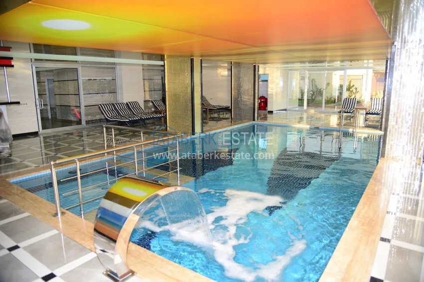 Квартира в Махмутларе с мебелью видом на горы в комплексе с частным пляжем  13 