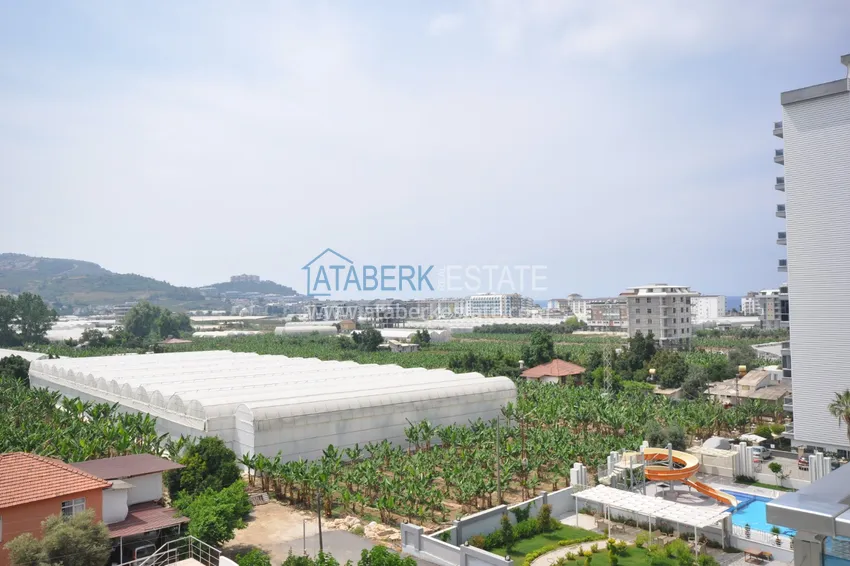 Приобрести Квартира в Махмутларе с мебелью видом на горы в комплексе с частным пляжем  12 