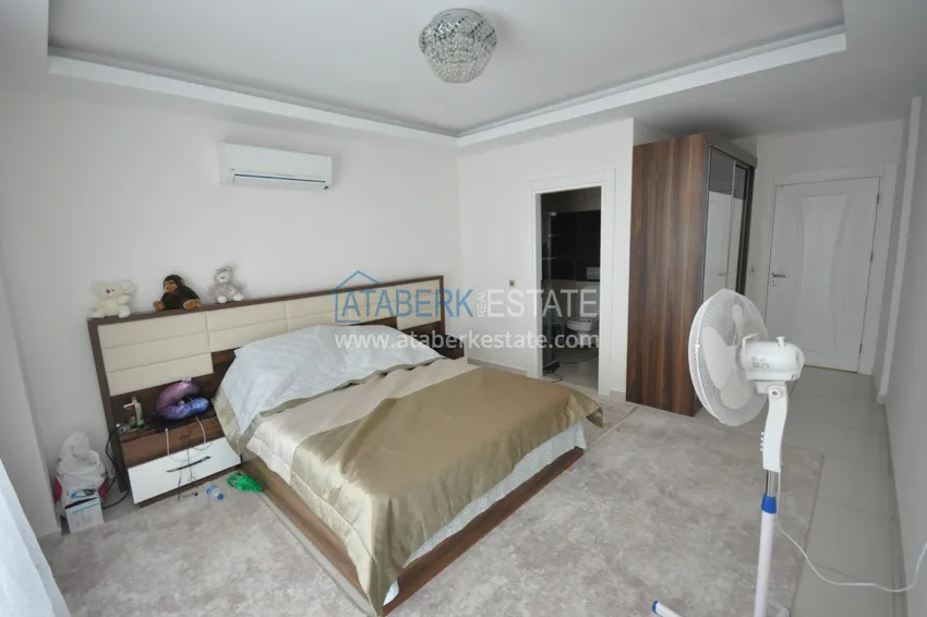 Приобрести Квартира в Махмутларе с мебелью видом на горы в комплексе с частным пляжем  13 