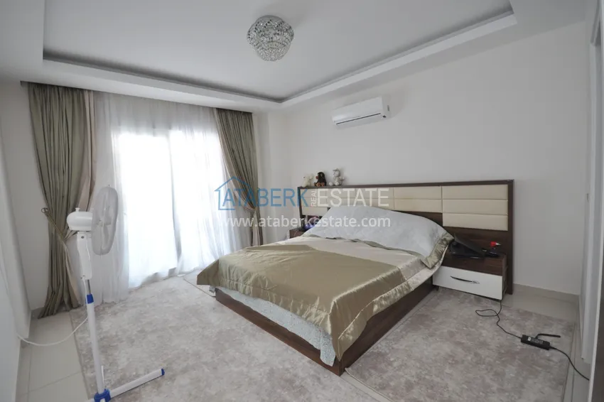 Приобрести Квартира в Махмутларе с мебелью видом на горы в комплексе с частным пляжем  14 