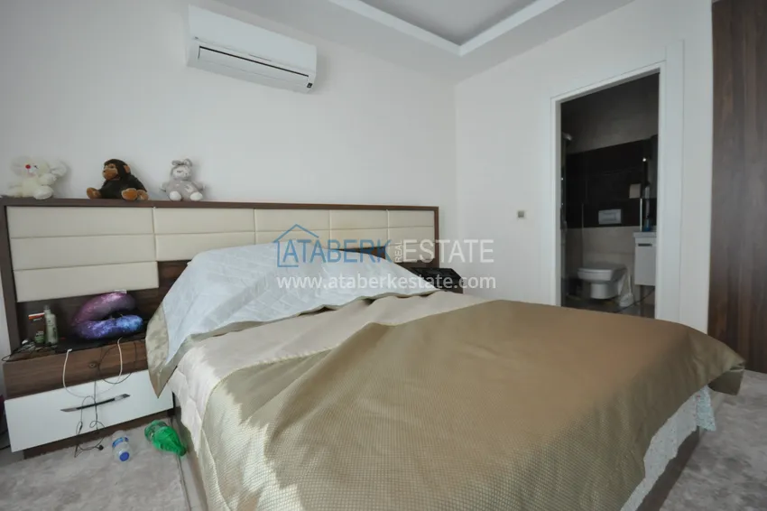 Приобрести Квартира в Махмутларе с мебелью видом на горы в комплексе с частным пляжем  15 