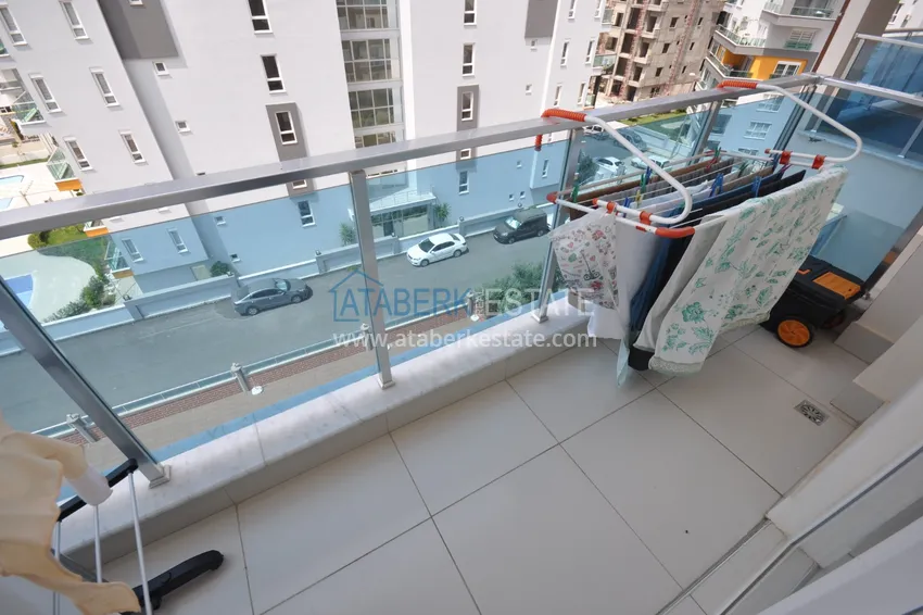 Приобрести Квартира в Махмутларе с мебелью видом на горы в комплексе с частным пляжем  17 