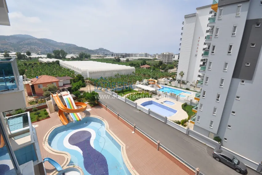 Приобрести Квартира в Махмутларе с мебелью видом на горы в комплексе с частным пляжем  19 