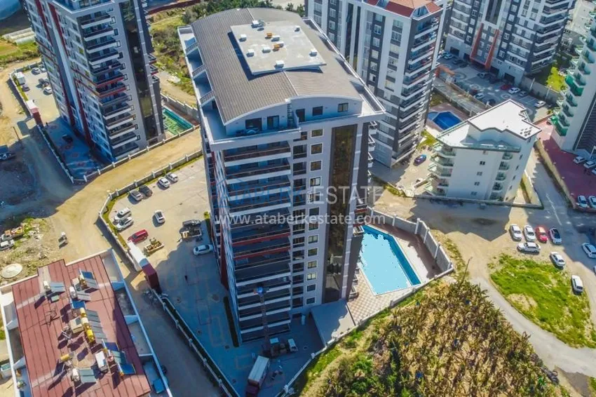 Квартира с чистовой отделкой в Махмутларе в новом комплексе 1