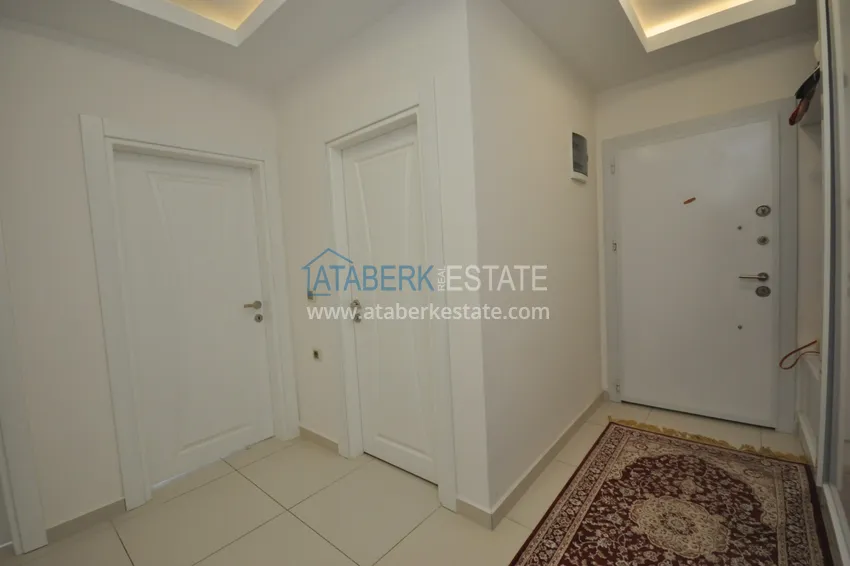 Приобрести Квартира в Махмутларе с мебелью видом на горы в комплексе с частным пляжем  1 