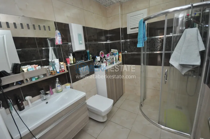 Приобрести Квартира в Махмутларе с мебелью видом на горы в комплексе с частным пляжем  22 