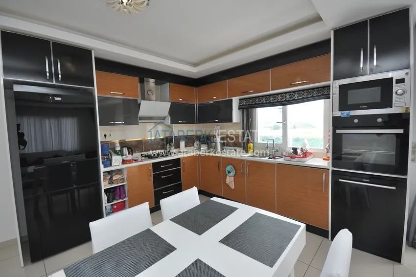 Приобрести Квартира в Махмутларе с мебелью видом на горы в комплексе с частным пляжем  6 