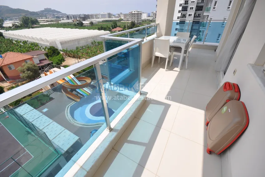 Приобрести Квартира в Махмутларе с мебелью видом на горы в комплексе с частным пляжем  8 