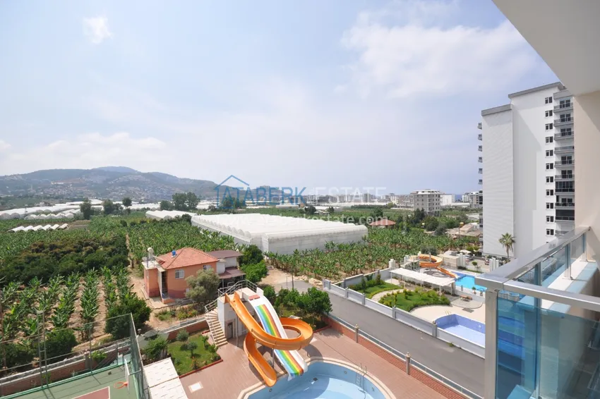 Приобрести Квартира в Махмутларе с мебелью видом на горы в комплексе с частным пляжем  10 