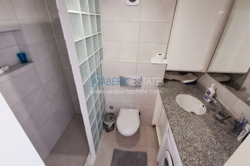 Приобрести Квартира в Авсалларе с мебелью в эксклюзивном комплексе рядом с пляжем Инджекум 14 