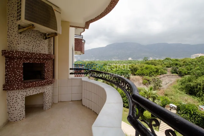 Приобрести Квартира в Махмутларе с 3 спальнями, мебелью, видом на горы 12 