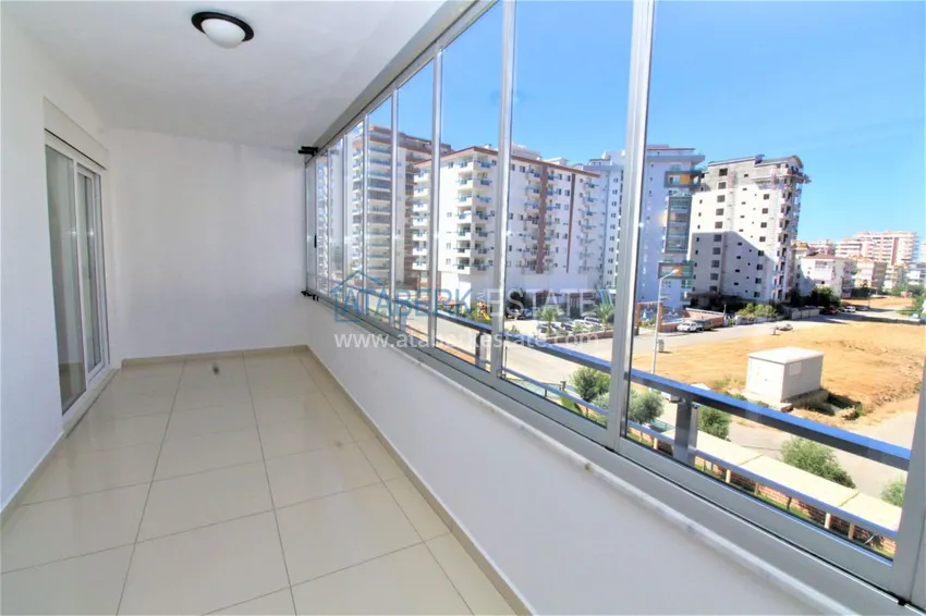 Приобрести Квартира в Махмутларе с мебелью, застекленным балконом в благоустроенной резиденции 15 