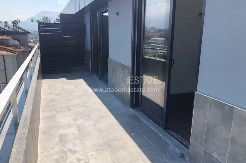 Приобрести Пентхаус в центре Алании с открытым видом на море в молодой резиденции 22 