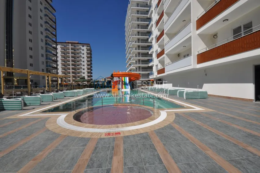 Квартира в Махмутларе с мебелью, застекленным балконом в благоустроенной резиденции 7 