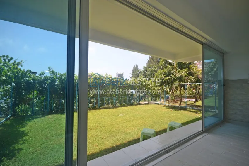 Приобрести Трехуровневая смежная вилла в районе Демирташ с собственным садом 1 