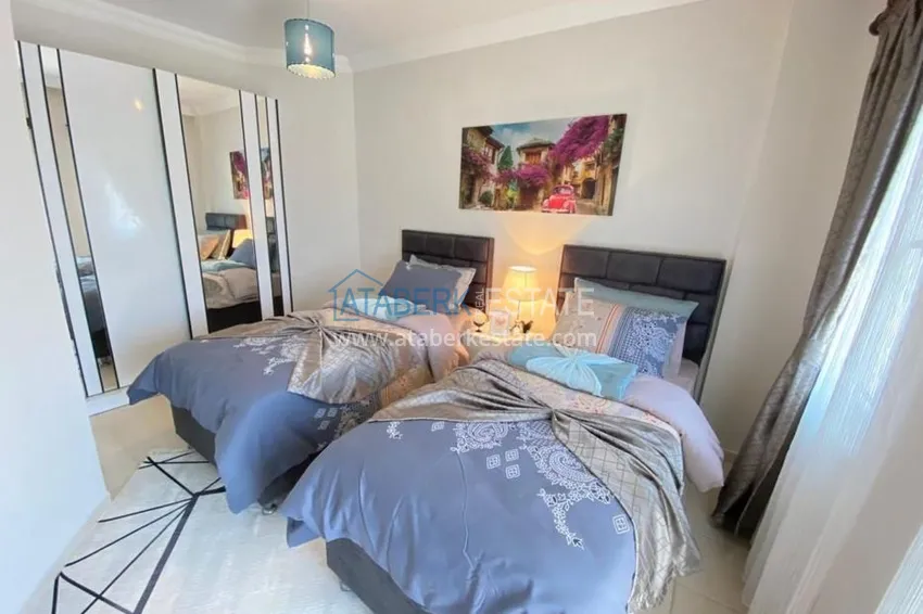 Приобрести Таунхаус в районе Демирташ с мебелью и открытым видом на море  12 