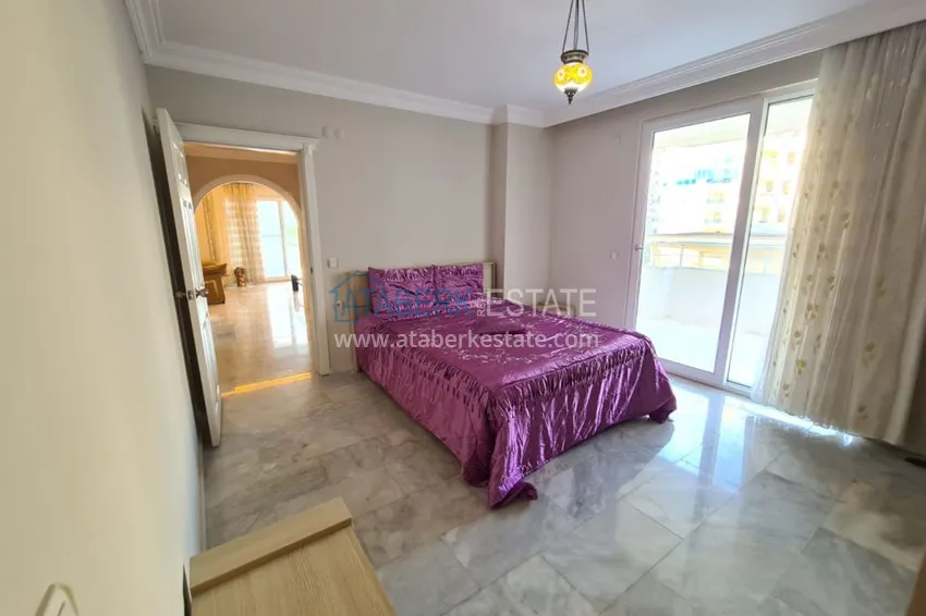 Приобрести Трехкомнатная квартира в Махмутларе, с мебелью рядом с морем 11 