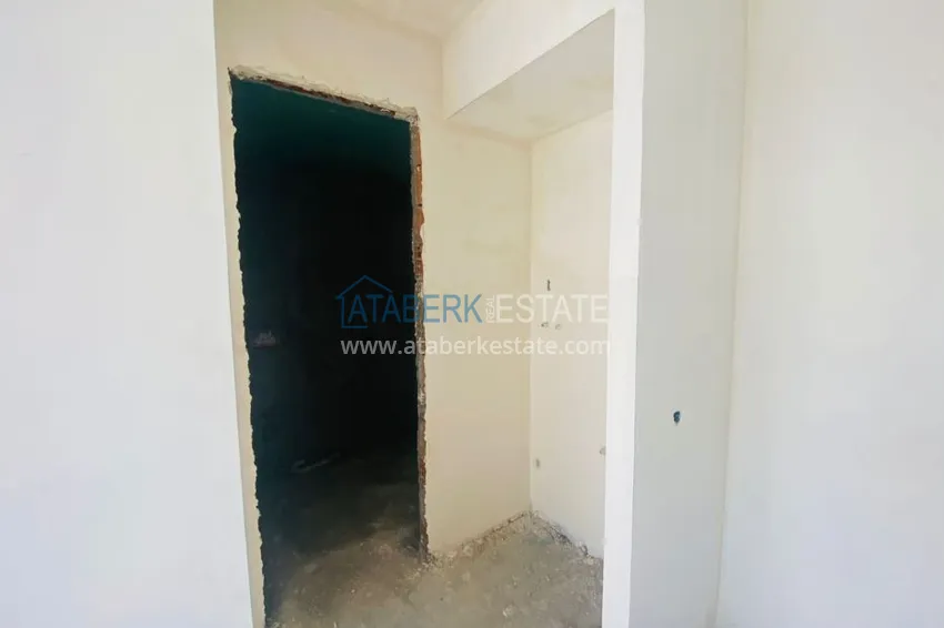 Приобрести Двухкомнатная квартира в центре Алании с частичным видом на море в строящемся комплексе  14 