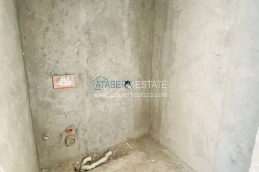 Приобрести Двухкомнатная квартира в центре Алании с частичным видом на море в строящемся комплексе  15 